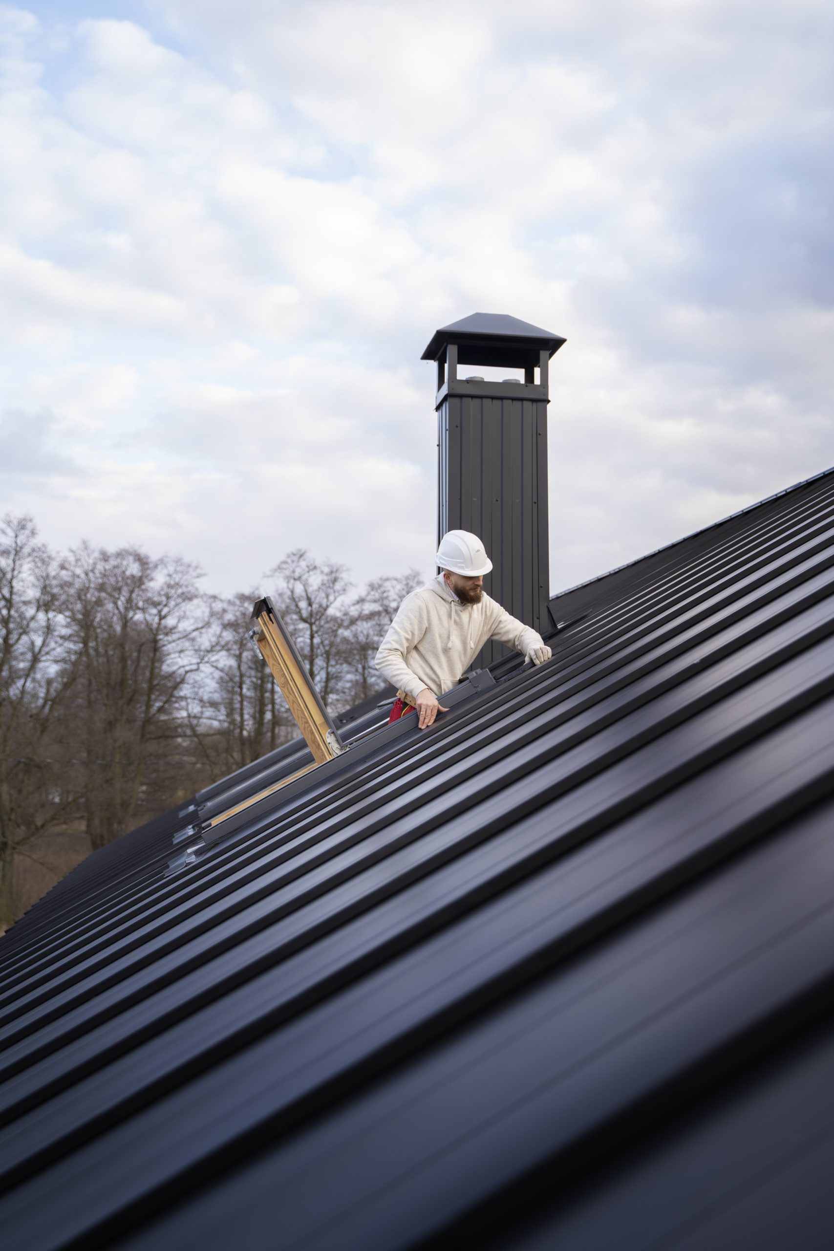 full-shot-man-working-roof-min